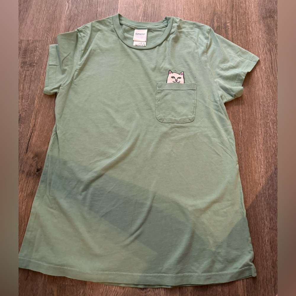 RipNDip cat tee with middle finger under pocket